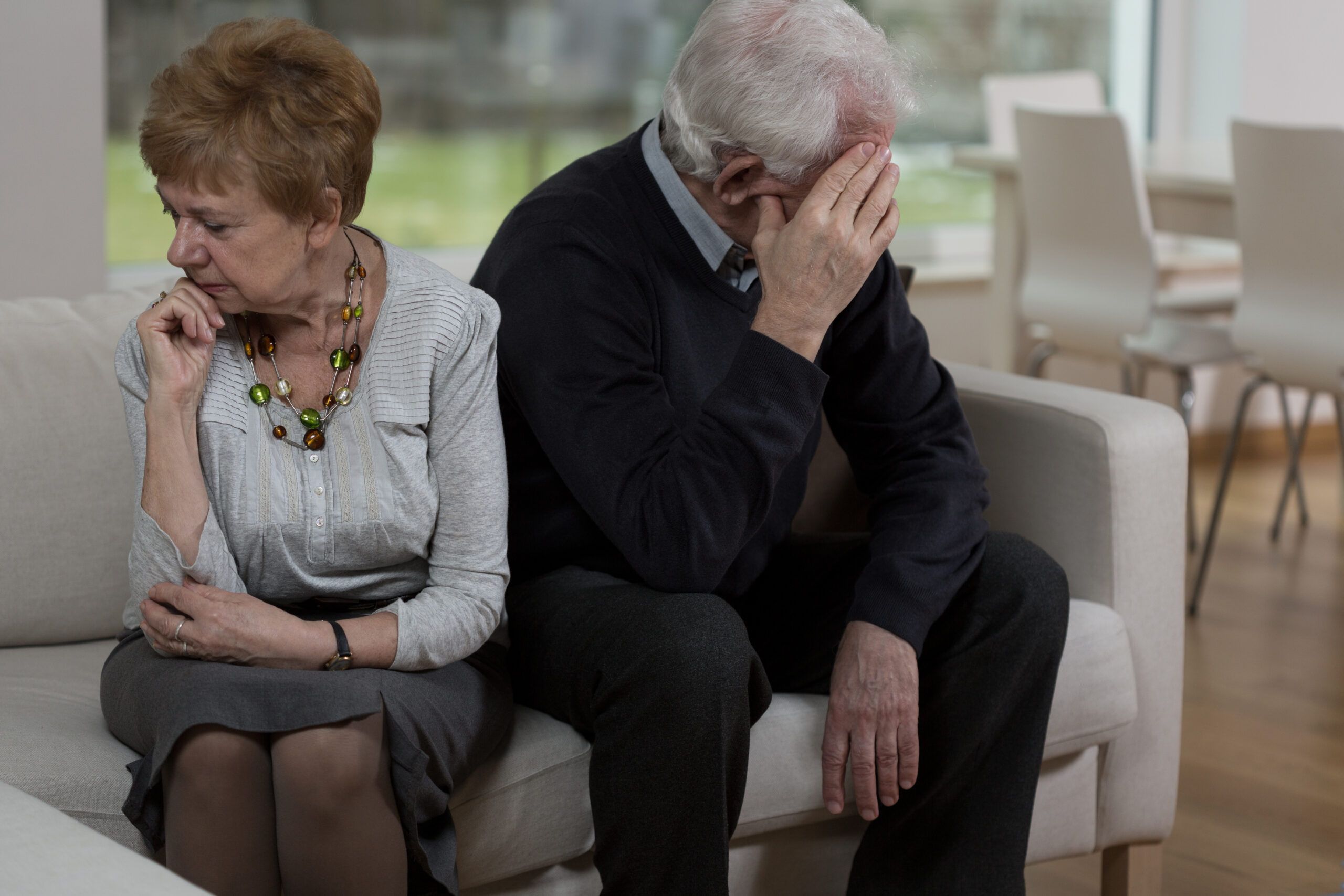 Older couple sitting together but facing away from each other | Retirement Benefits in Divorce Experts Vetrano | Vetrano & Feinman