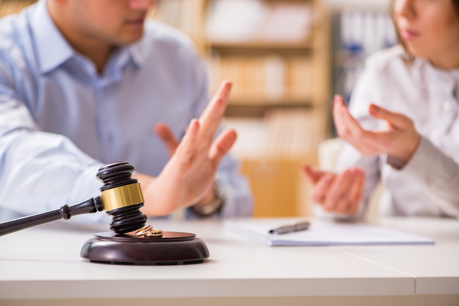 Couple arguing in front of a gavel | Divorce Services | Vetrano | Vetrano & Feinman LLC