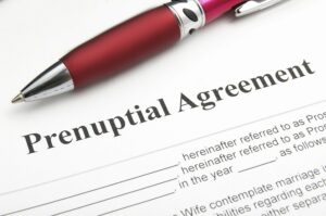 Prenupital Agreement with pen placed at top | Wayne Family Attorney discusses prenuptial and premarital agreements
