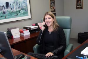 Main Line family law attorney Sarinia M. Feinman at desk | Marital Status for Tax Filing purposes | Vetrano | Vetrano & Feinman