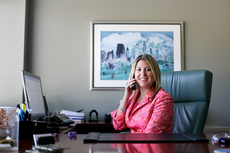 Family Attorney Sarinia Feinman at a desk. Attorneys are still working with clients remotely due to COVID-19 restrictions. | Vetrano | Vetrano & Feinman LLC