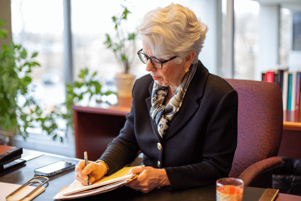 Kate Vetrano at desk working | Vetrano Vetrano & Feinman